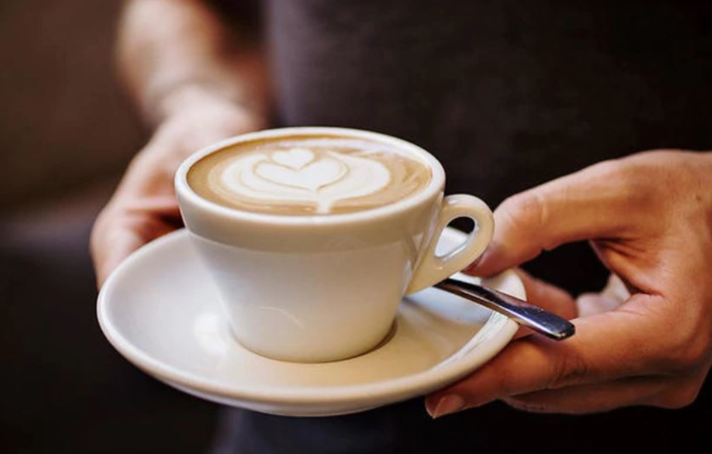 Mug medium rich foam froth cinnamon aromatic coffee